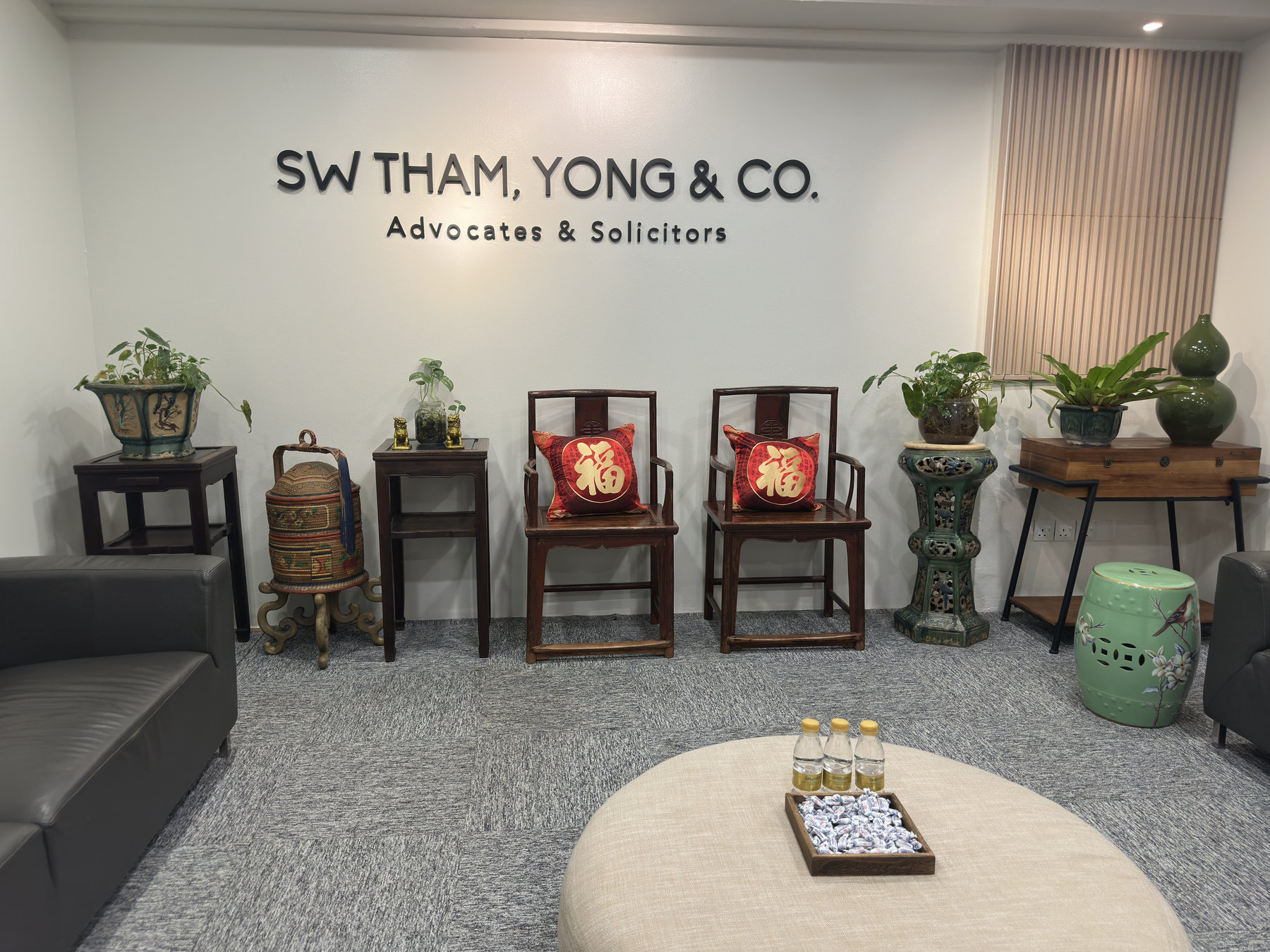Reception area of SW Tham, Yong & Co. with the firm's name on the wall